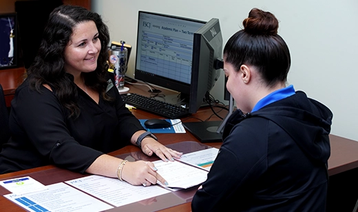 A student and FSCJ advisor