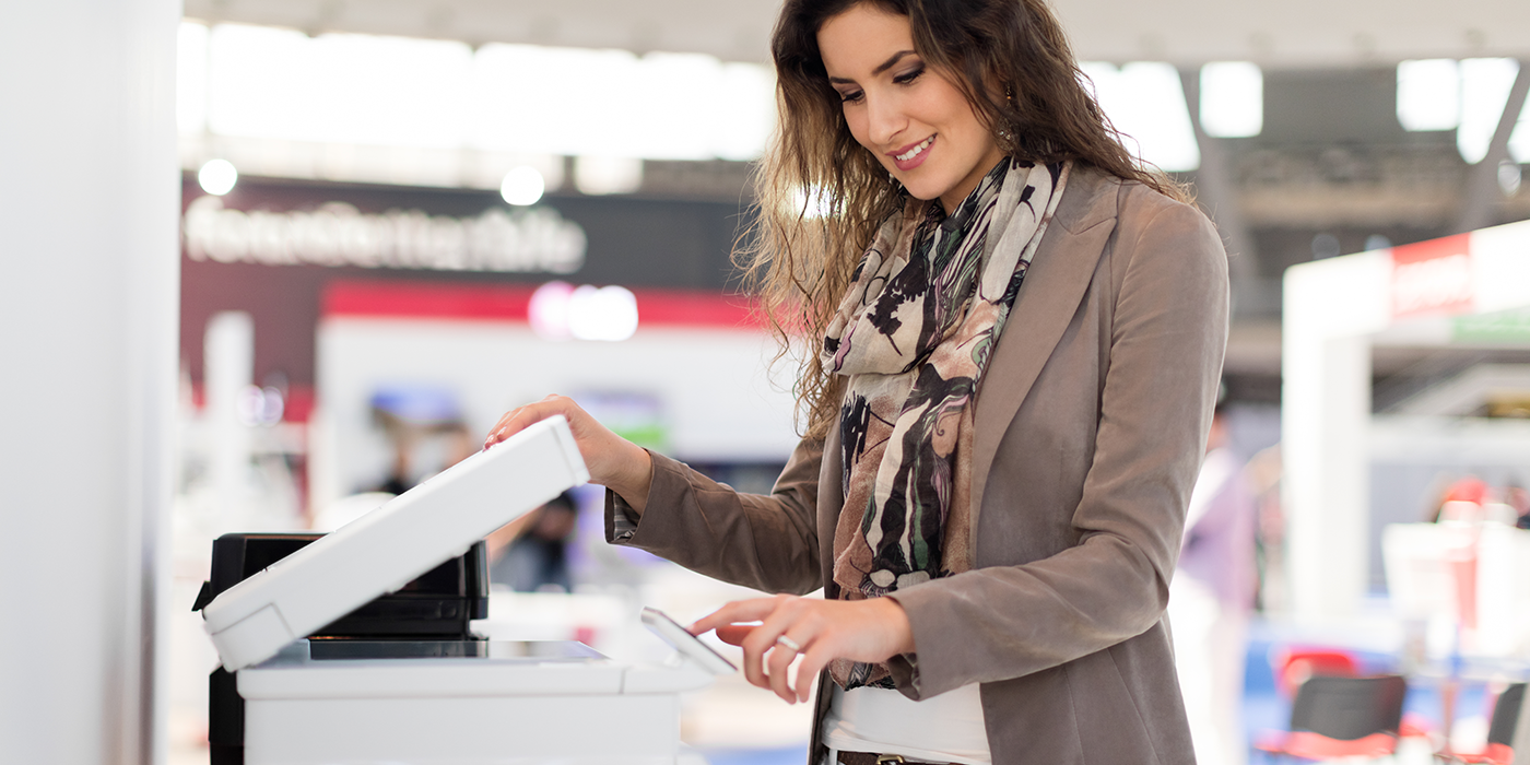 A woman using a photocopier