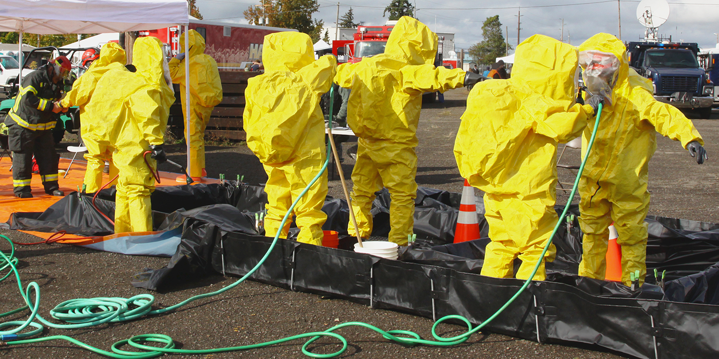 Several people in hazmat suits